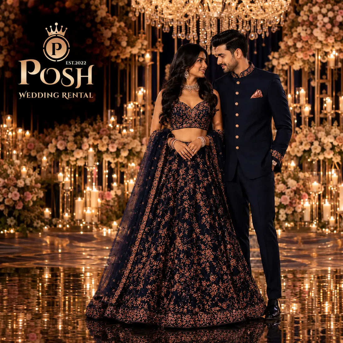 Luxury couple wedding outfit featuring a navy blue groom sherwani and embroidered bridal lehenga available for rent at Posh Wedding Rental.