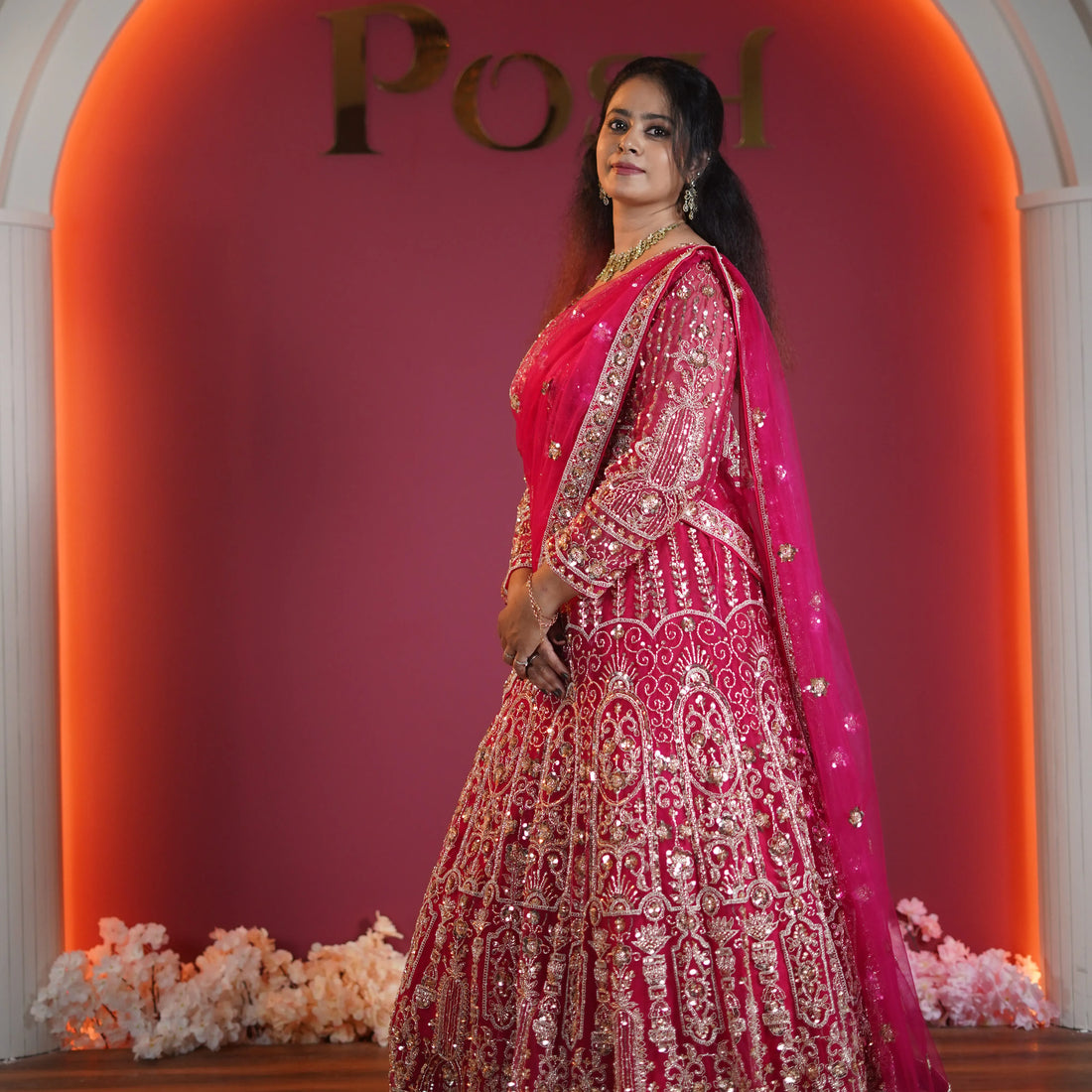 Bridal lehenga rental in Kochi – bride wearing luxury pink designer lehenga at Posh Wedding Rental Kerala