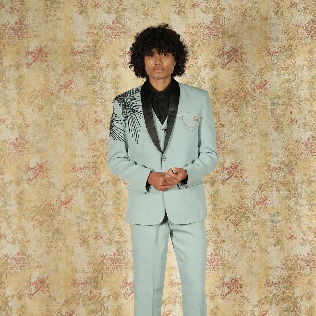 Blue designer groom suit with shoulder detailing and pocket chain