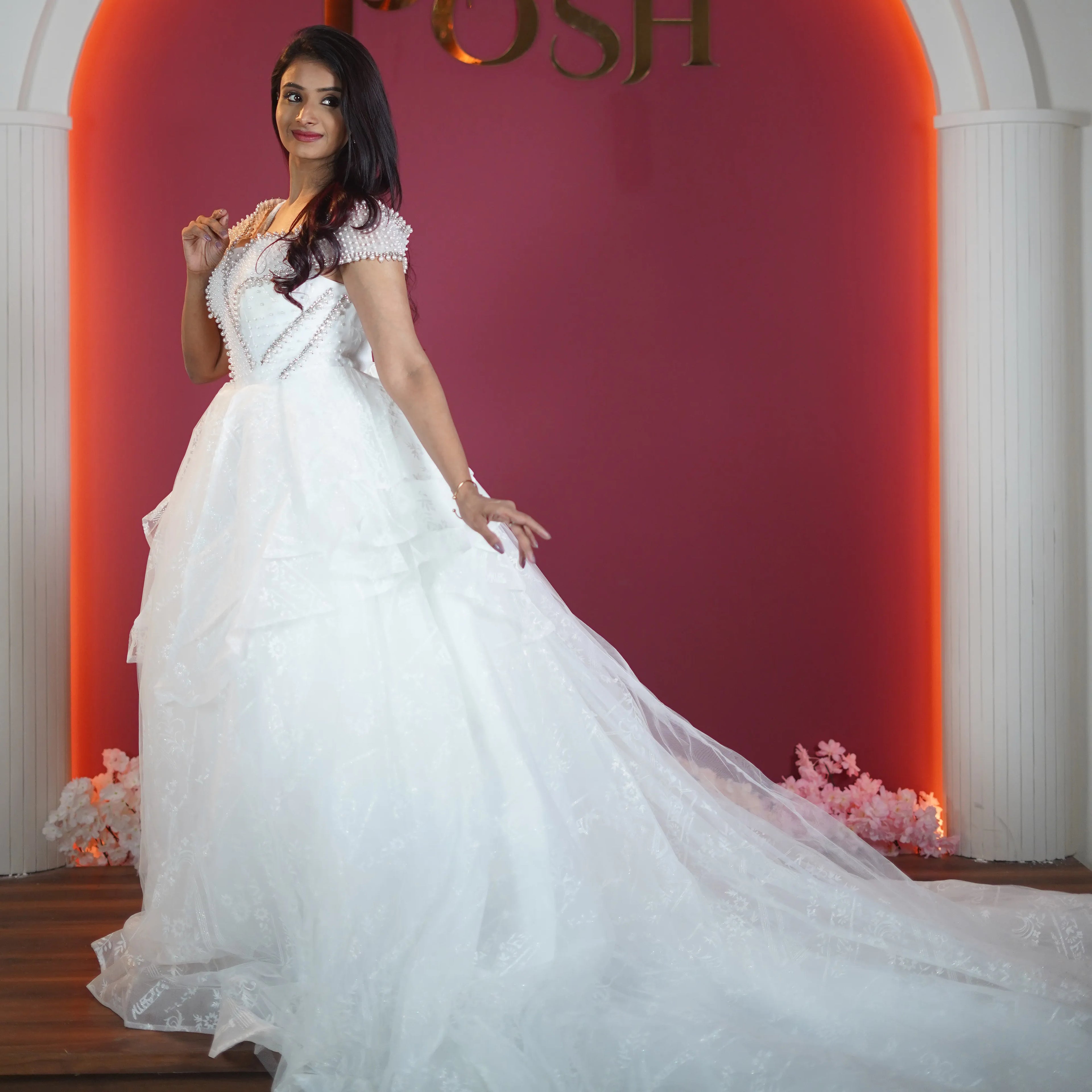 white princess bridal gown with long train available at Posh Wedding Rental Kerala bridal gown rental