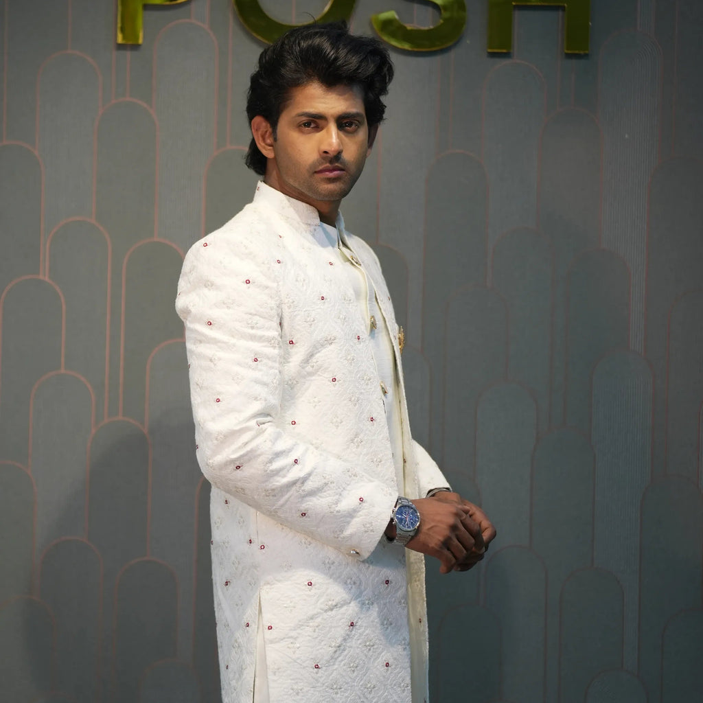 groom wearing rented Ivory White Indo-Western Set from posh wedding rental