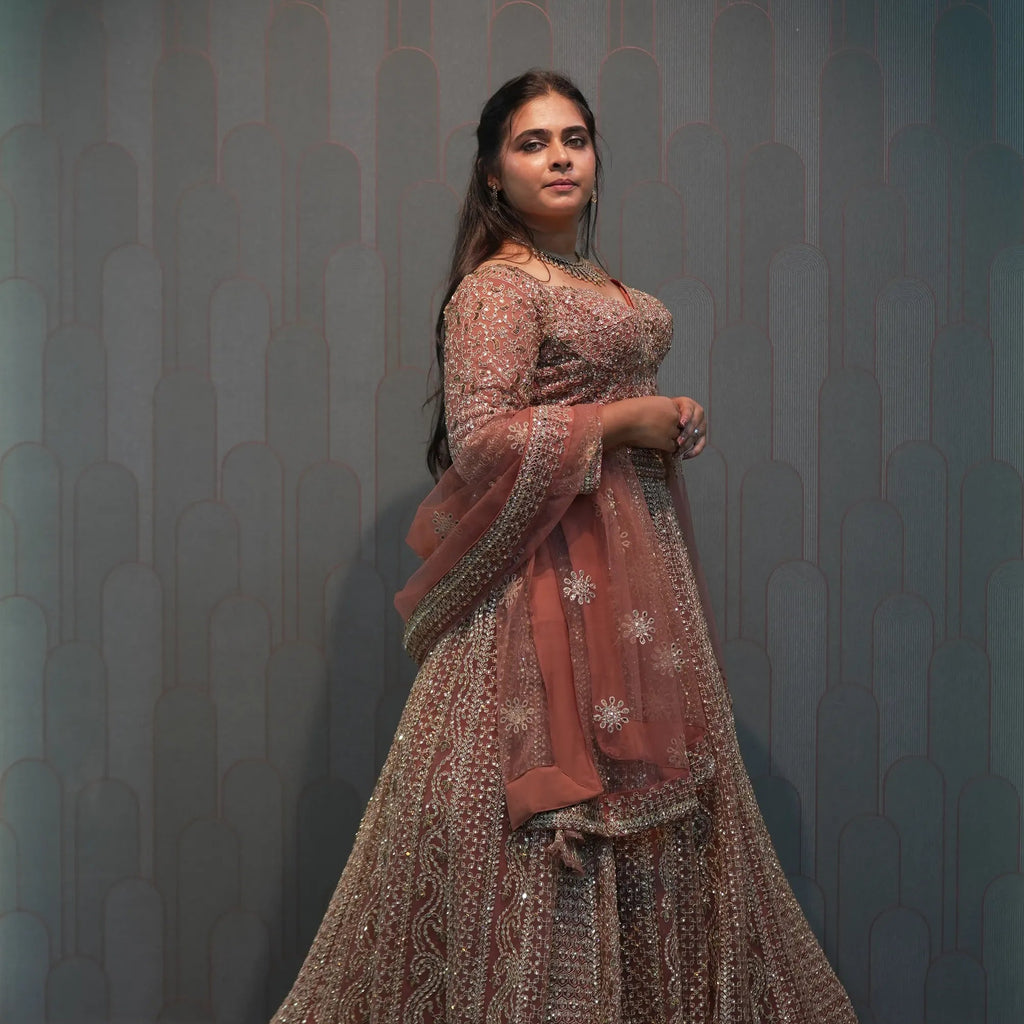 women wearing Light Brown Crop Top Lehenga for her wedding