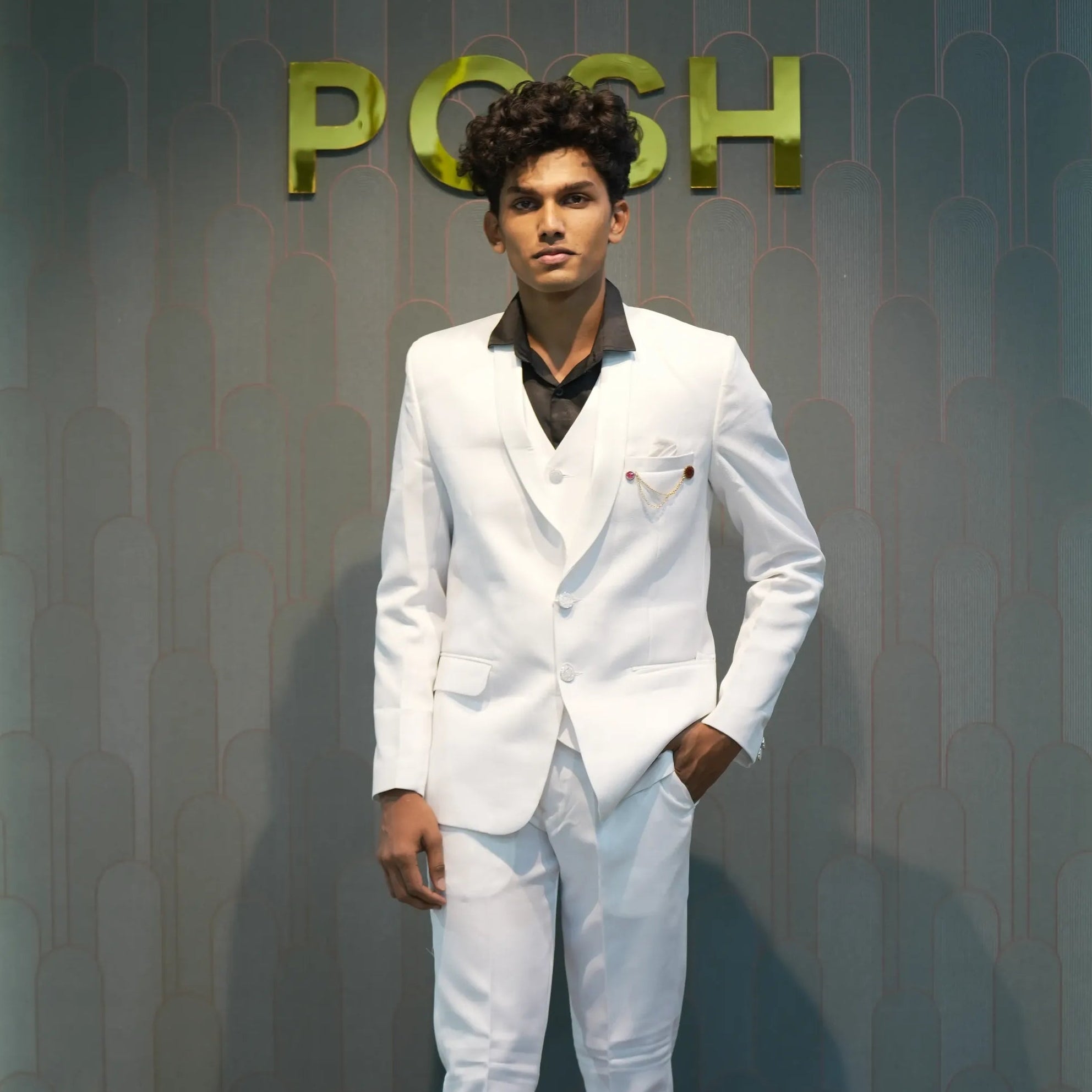 Boy wearing White Three-Piece Suit rented from Posh Wedding Rental