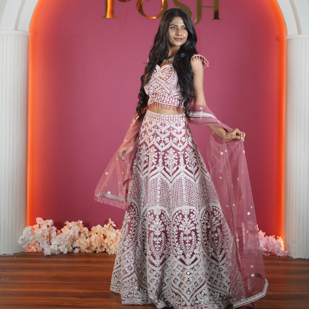 dusty rose designer bridal lehenga with heavy embroidery available at Posh Wedding Rental Kerala bridal lehenga rental