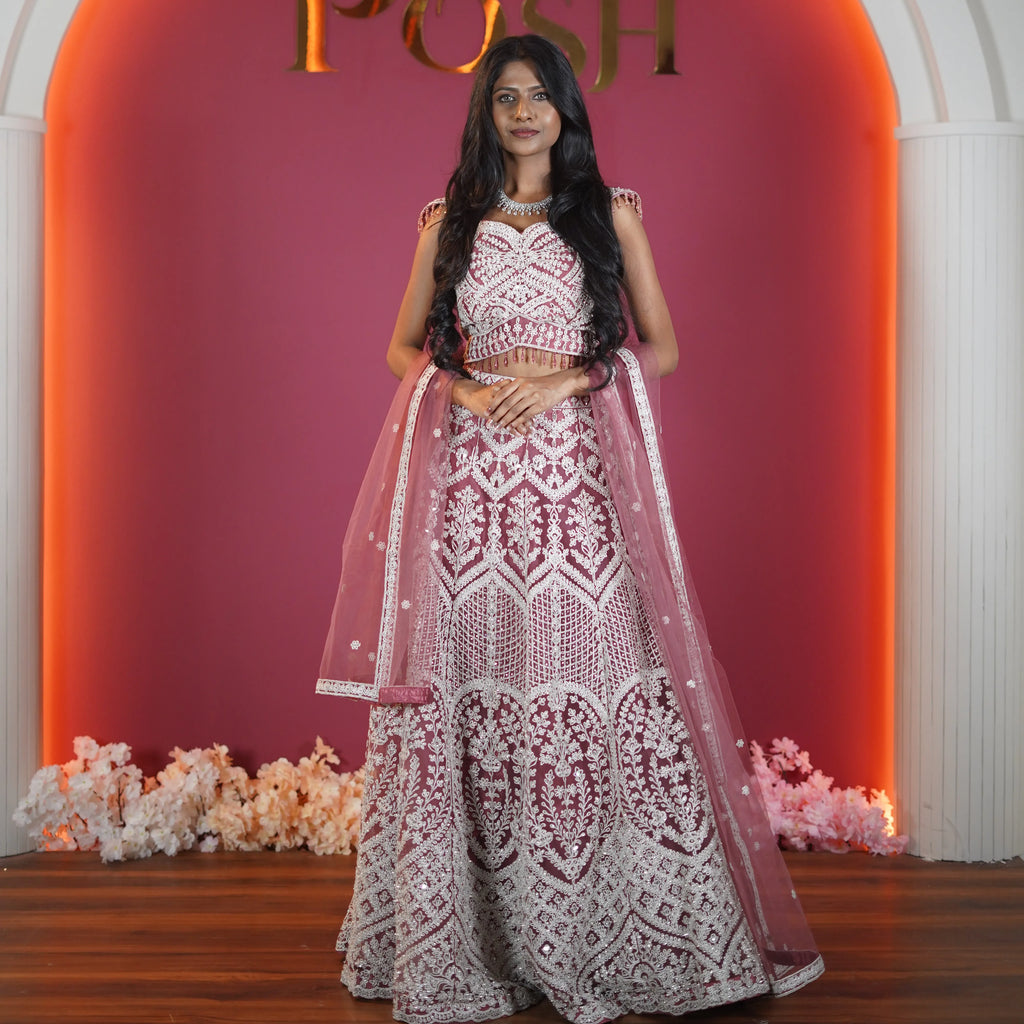 dusty rose designer bridal lehenga with heavy embroidery available at Posh Wedding Rental Kerala bridal lehenga rental