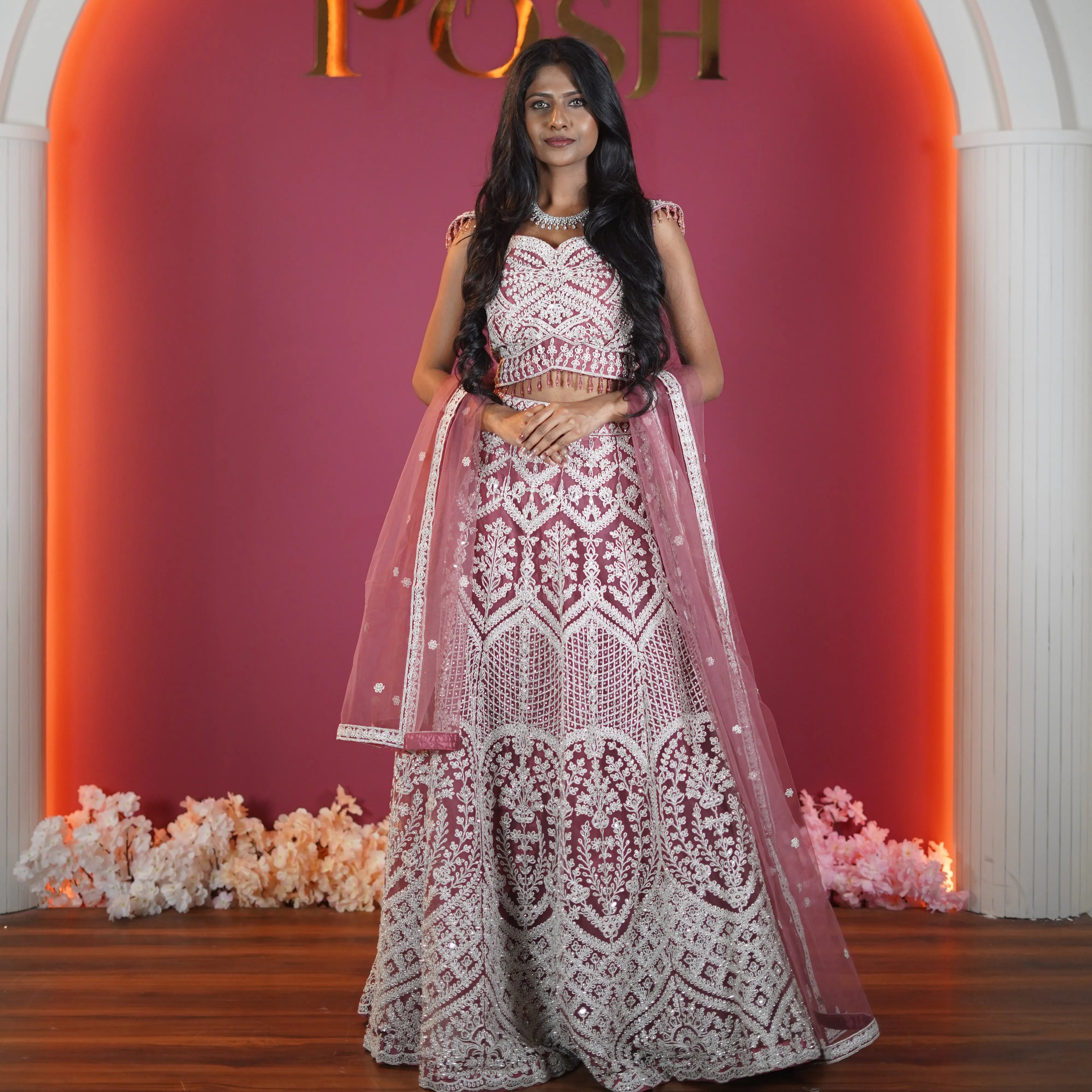dusty rose designer bridal lehenga with heavy embroidery available at Posh Wedding Rental Kerala bridal lehenga rental