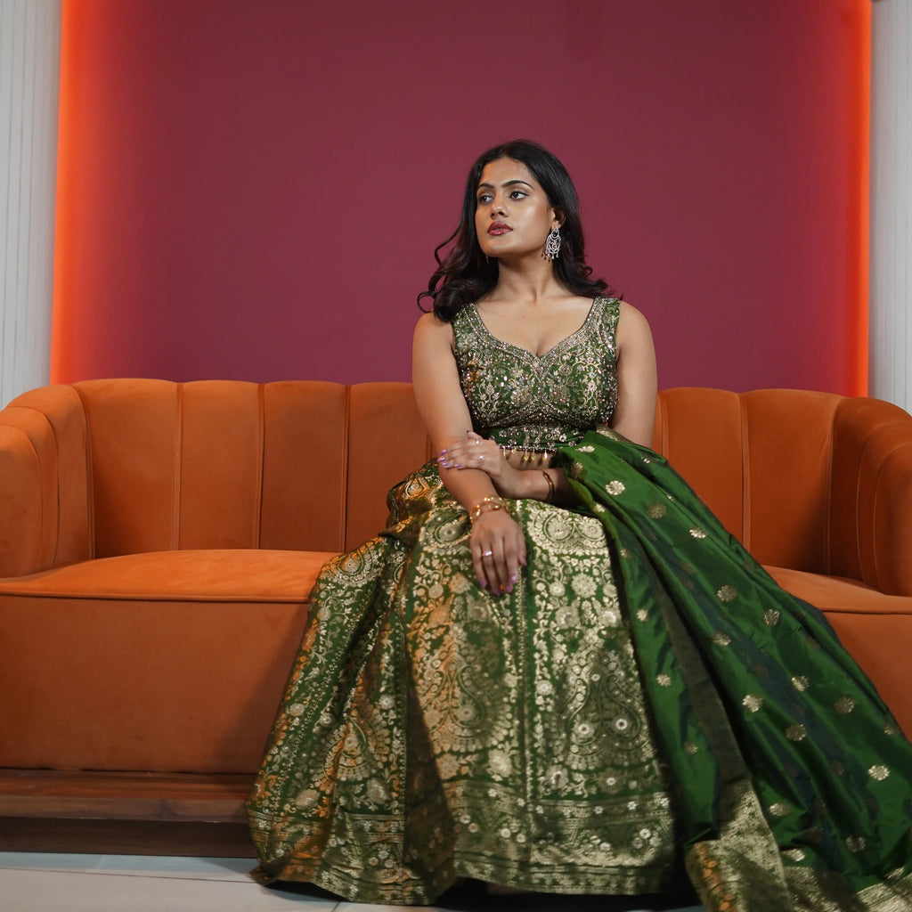 emerald green bridal lehenga with gold embroidery and dupatta available at Posh Wedding Rental Kerala lehenga rental