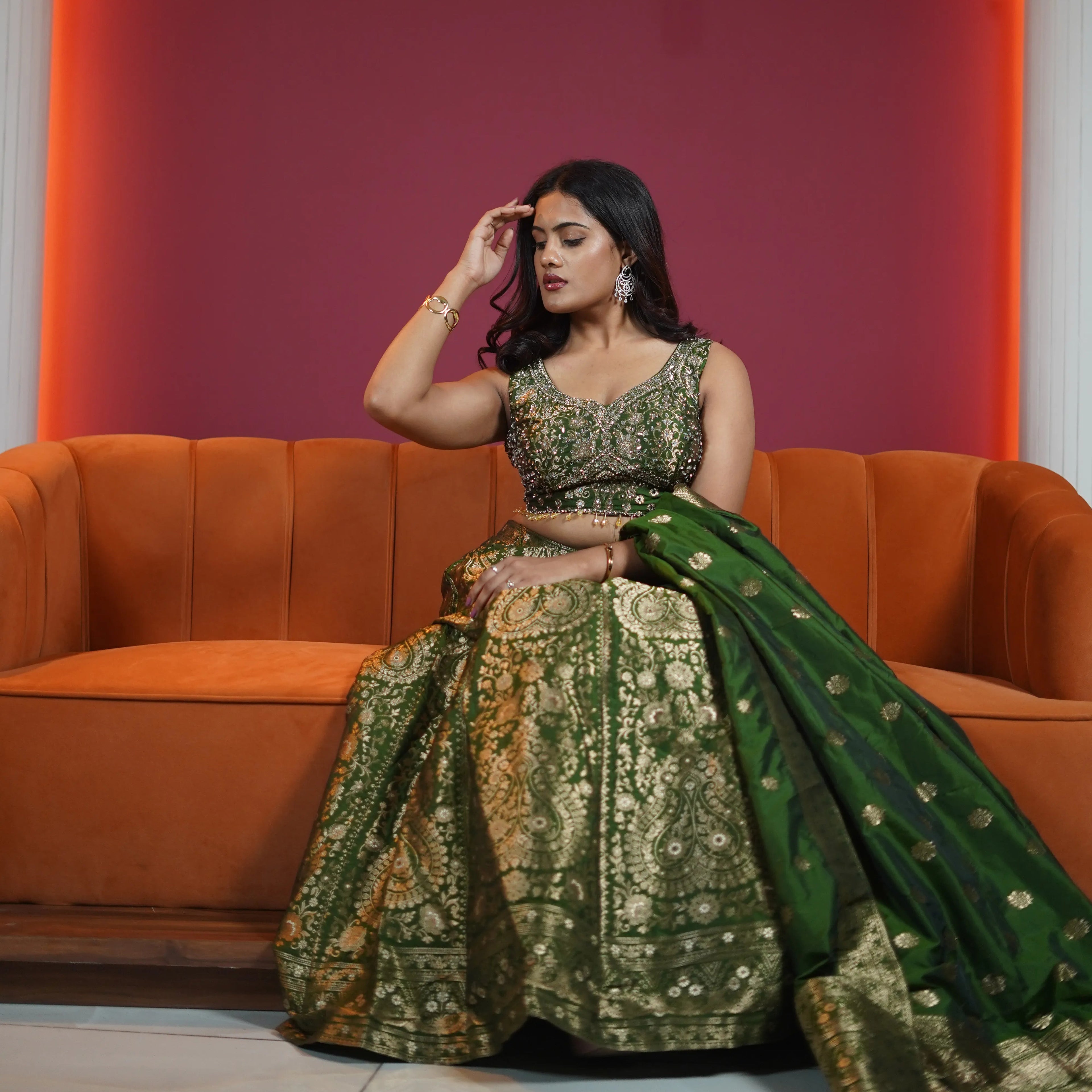 emerald green bridal lehenga with gold embroidery and dupatta available at Posh Wedding Rental Kerala lehenga rental