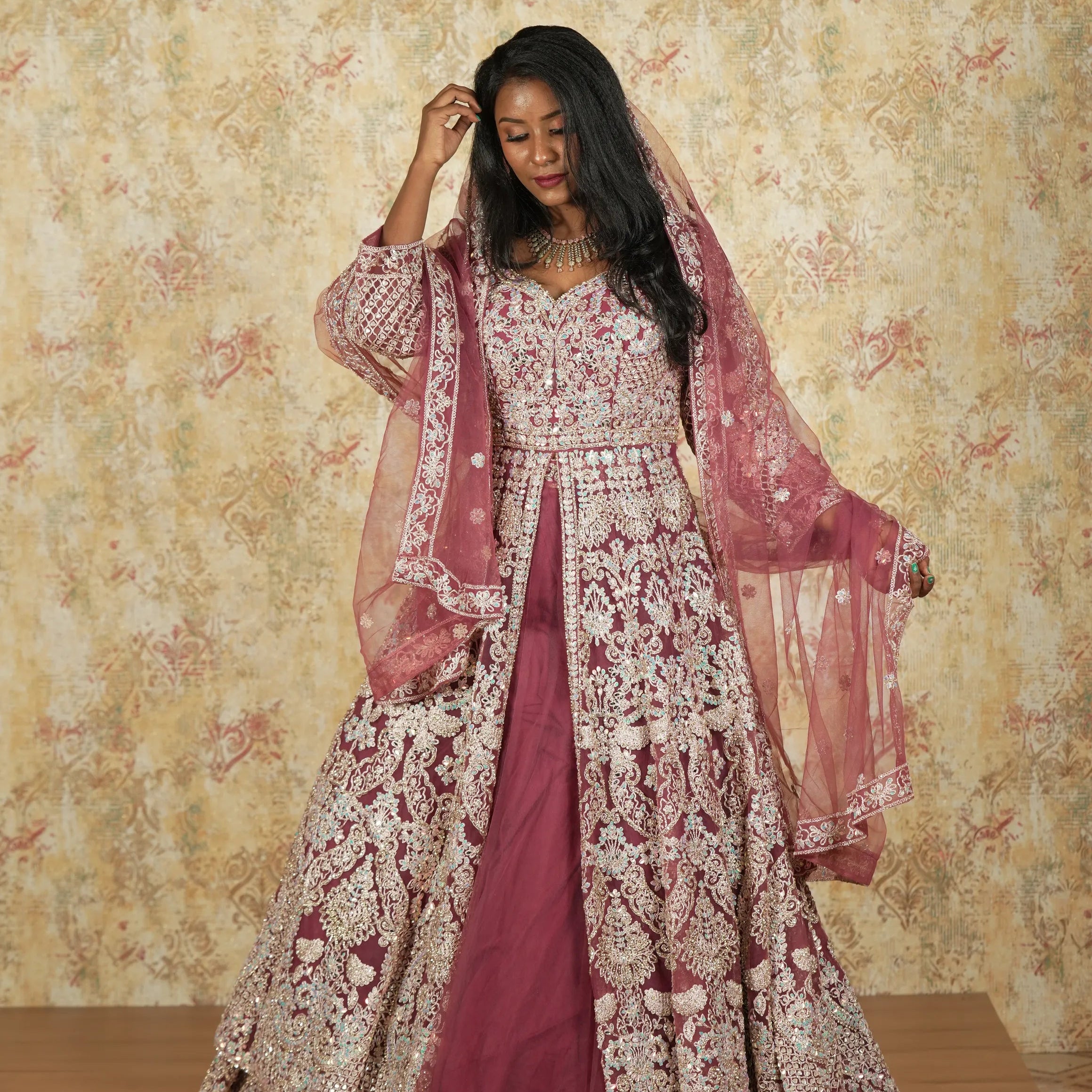 women wearing Maroon Arabic Bridal Lehenga rented by Posh Wedding Rental