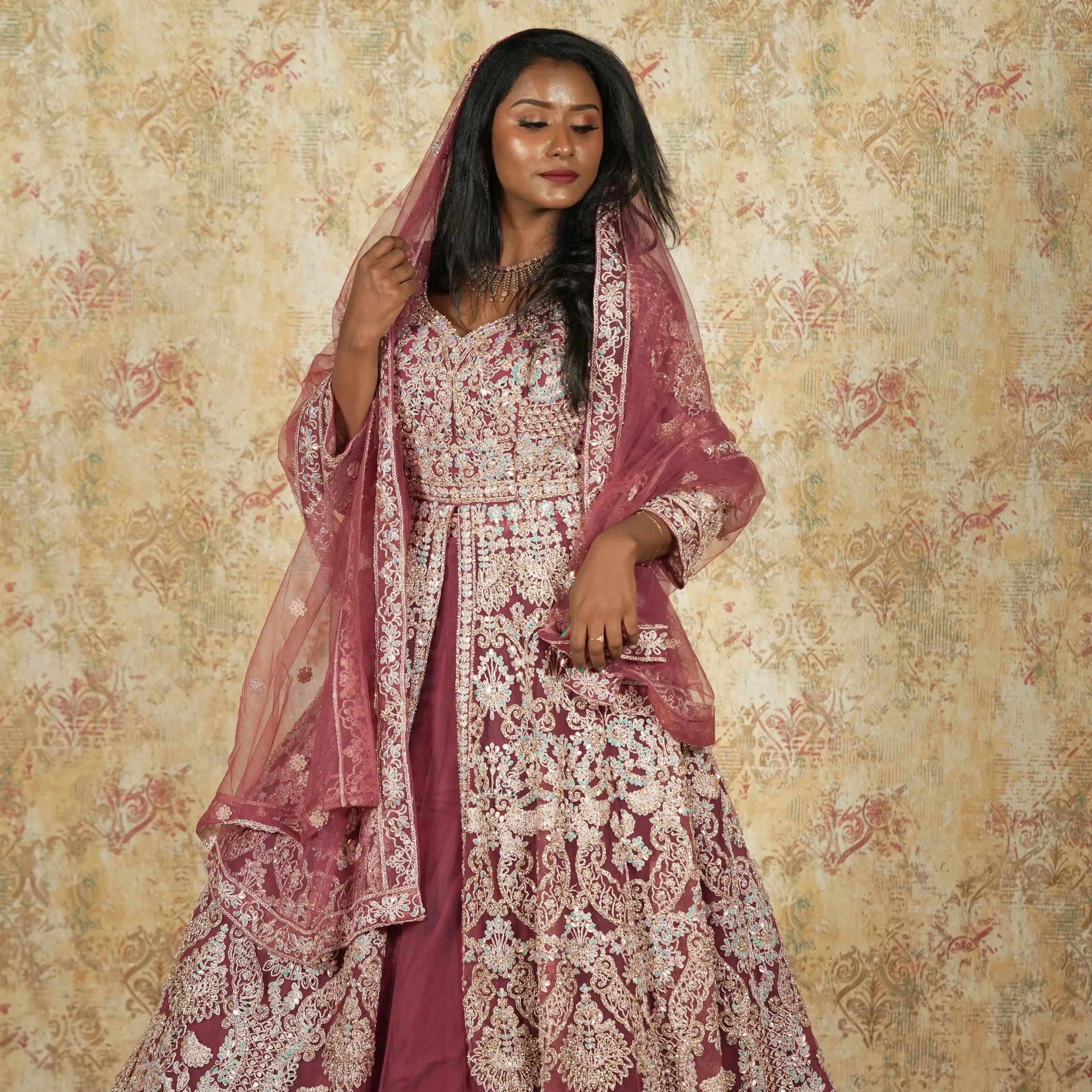 women wearing Maroon Arabic Bridal Lehenga rented by Posh Wedding Rental
