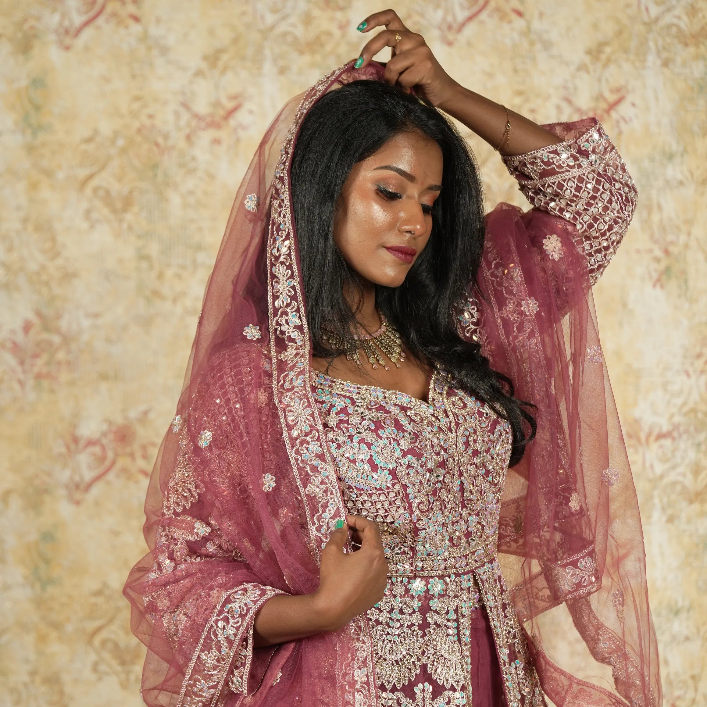 women wearing Maroon Arabic Bridal Lehenga rented by Posh Wedding Rental