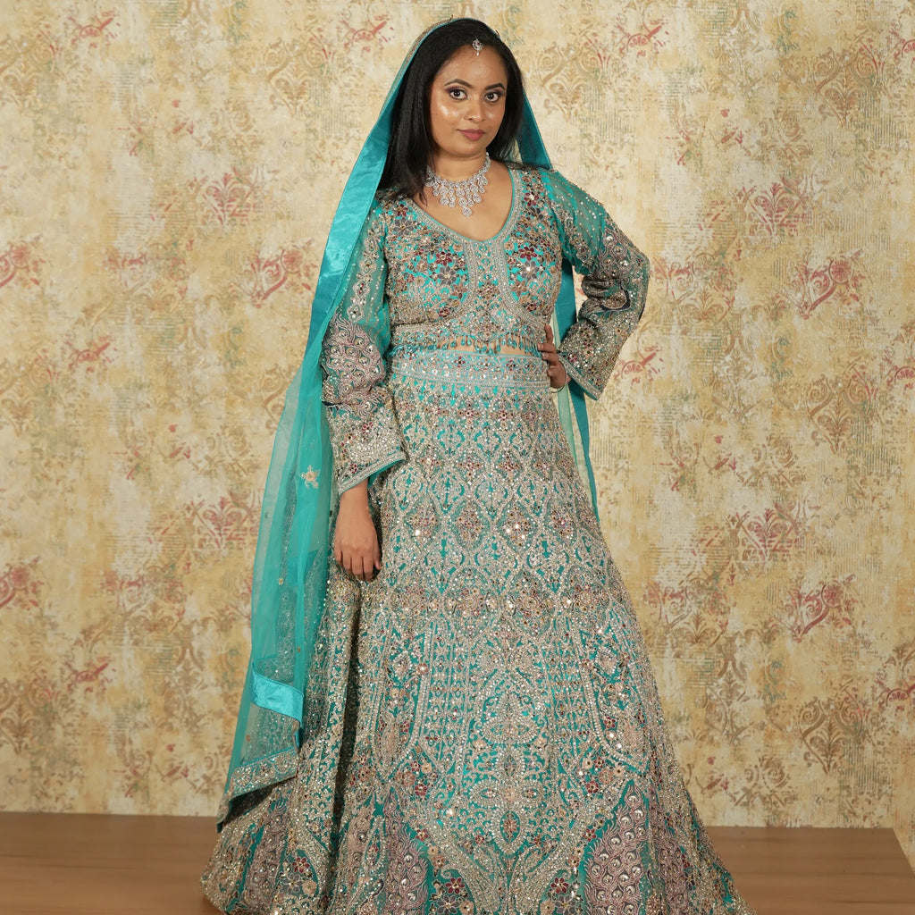 women wearing Aqua Blue Bridal Lehenga rented by posh wedding rental