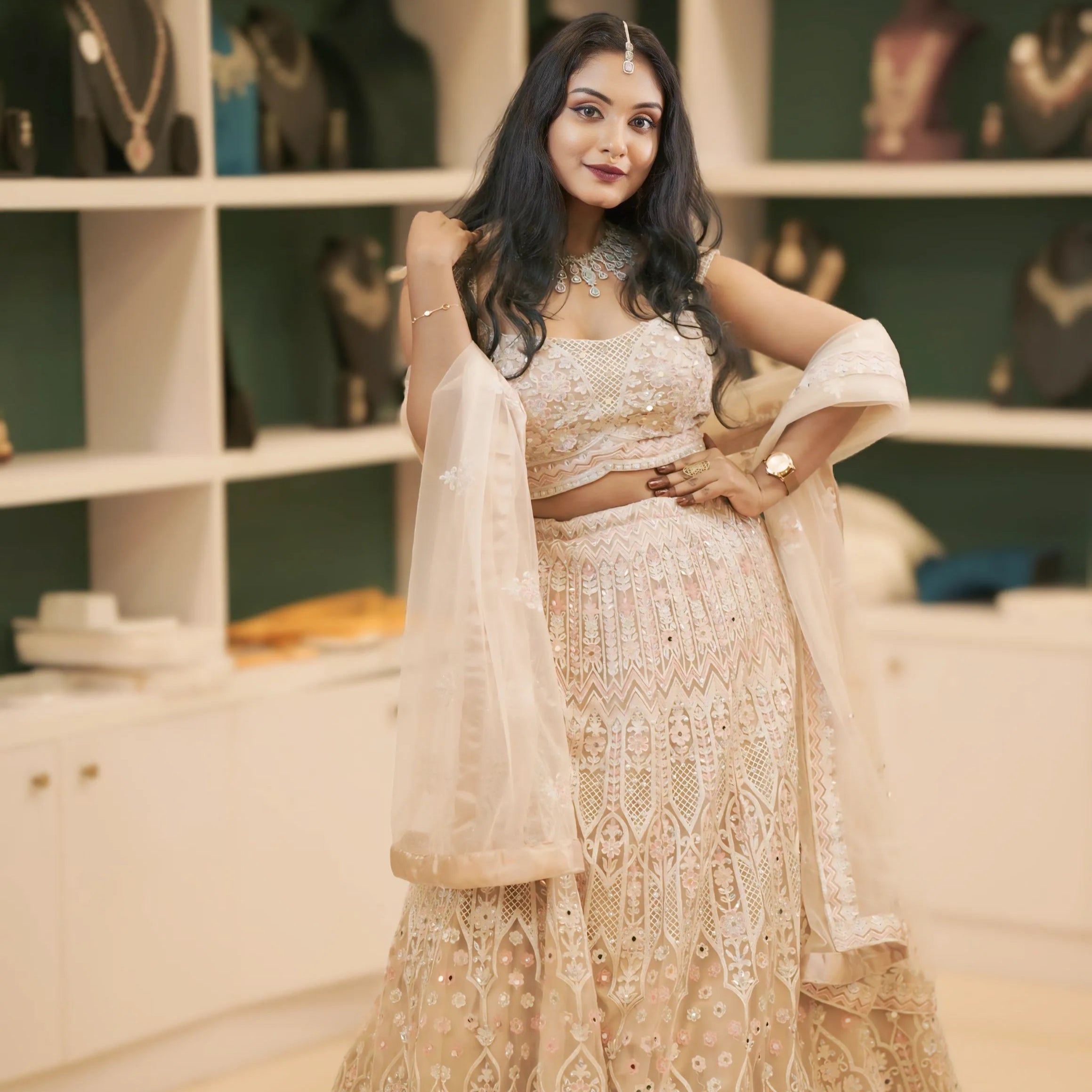 women wearing light pink embroidered lehenga 