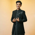 Groom wearing Black Indo-Western Sherwani for wedding
