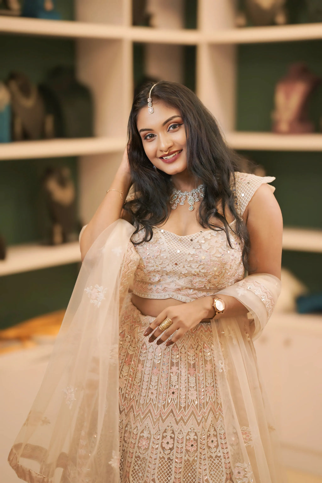 women wearing light pink embroidered lehenga 