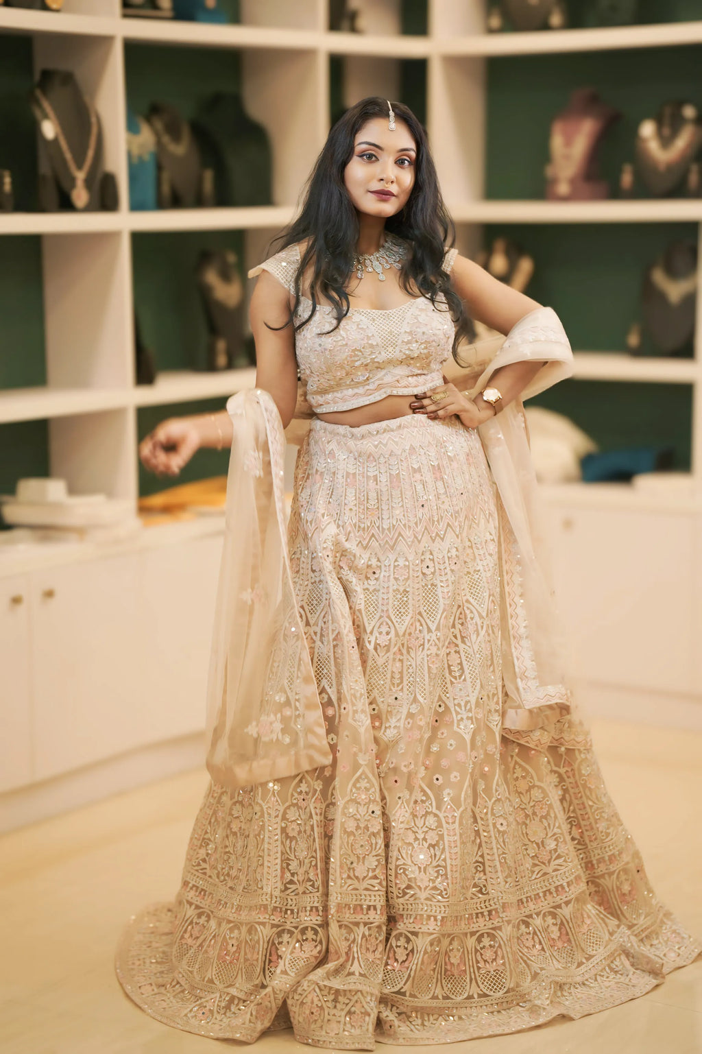 women wearing light pink embroidered lehenga 
