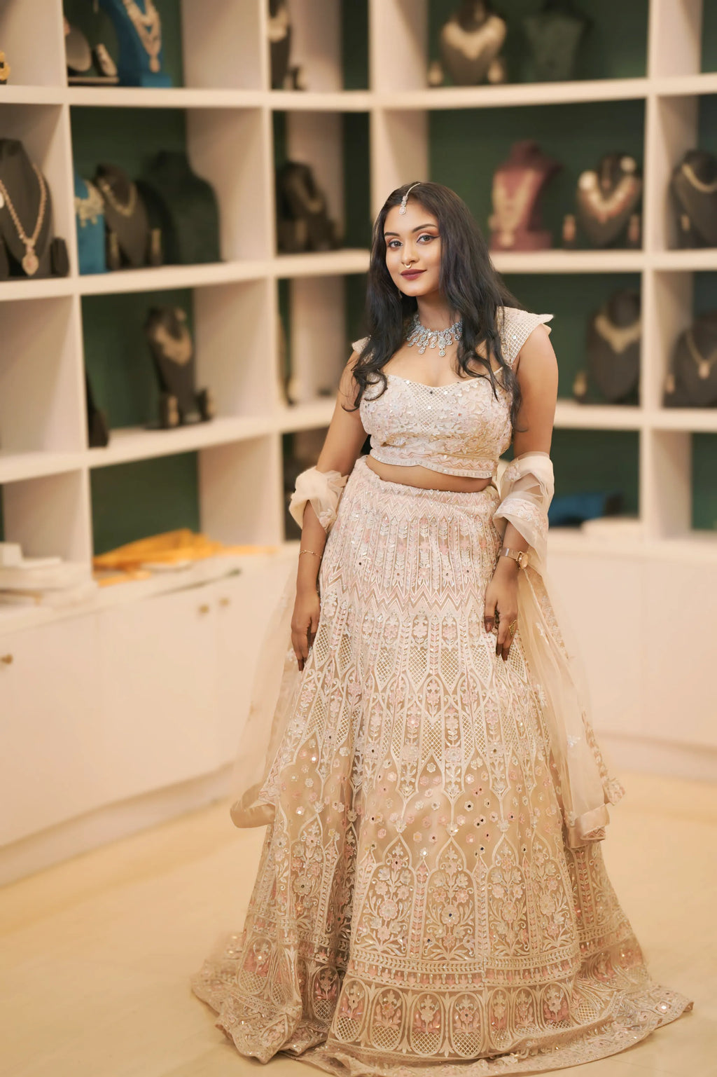 women wearing light pink embroidered lehenga 
