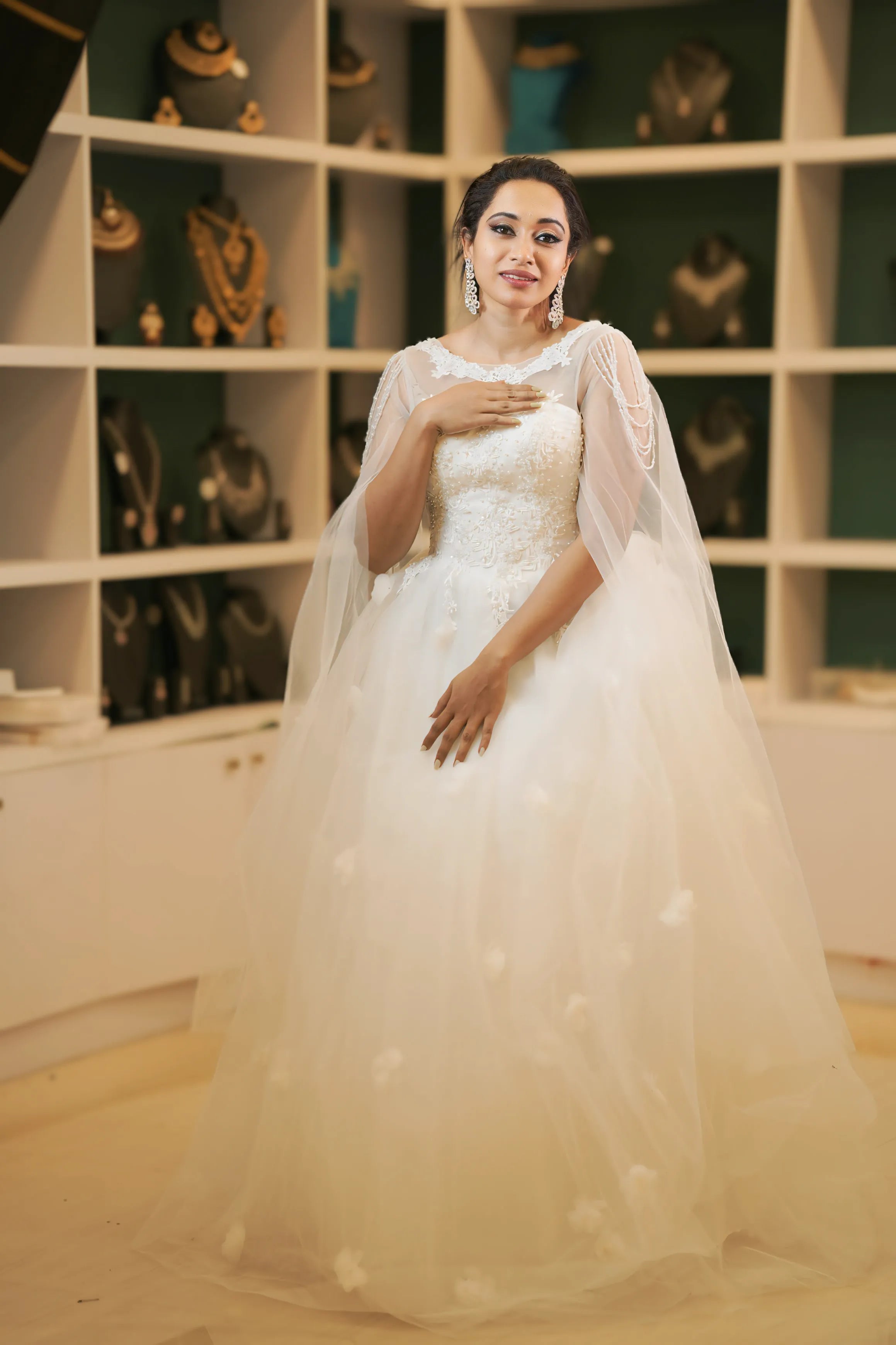 White Off-Shoulder Bridal Gown with Cape Overlay