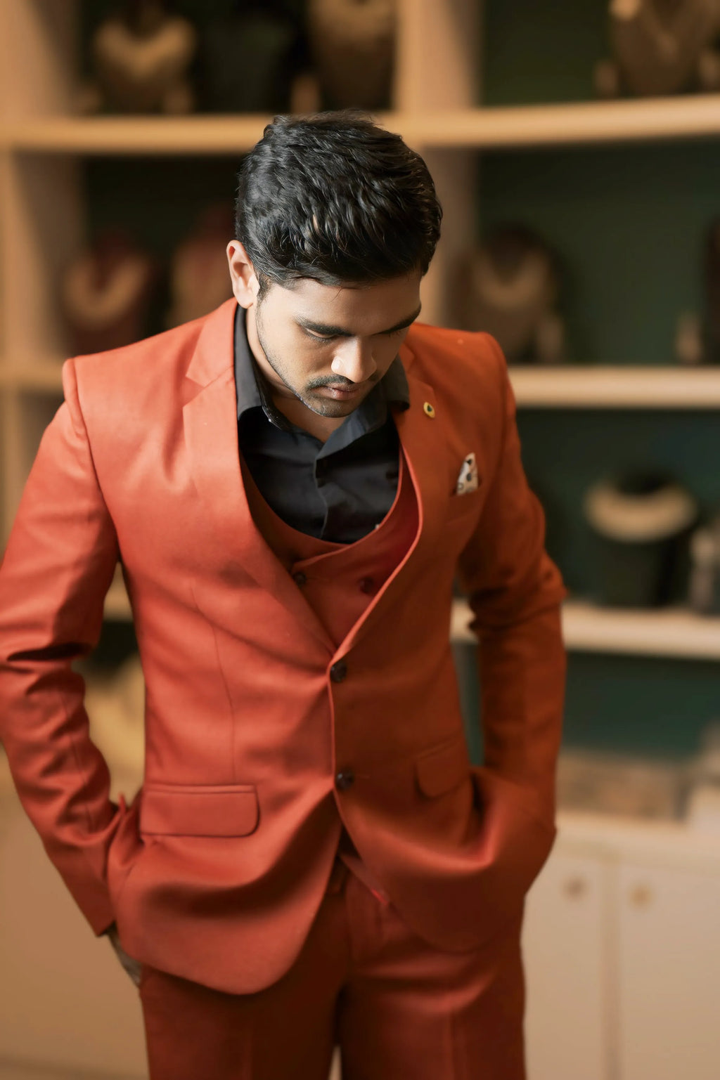 Boy wearing Rust Orange Three-Piece Suit for wedding