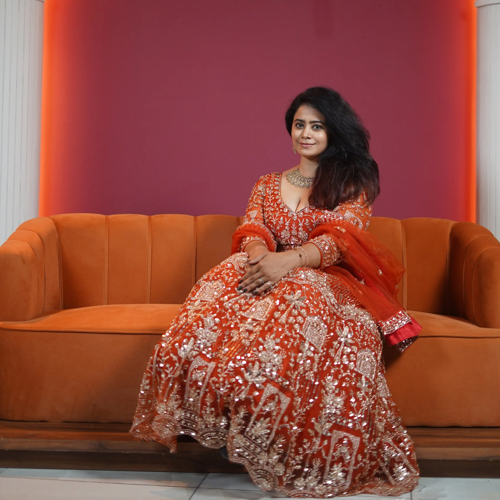 royal orange embroidered bridal lehenga with dupatta available at Posh Wedding Rental Kerala lehenga rental