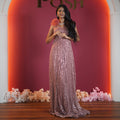 rose gold sequin evening gown with floral shoulder detail available at Posh Wedding Rental Kerala gown rental