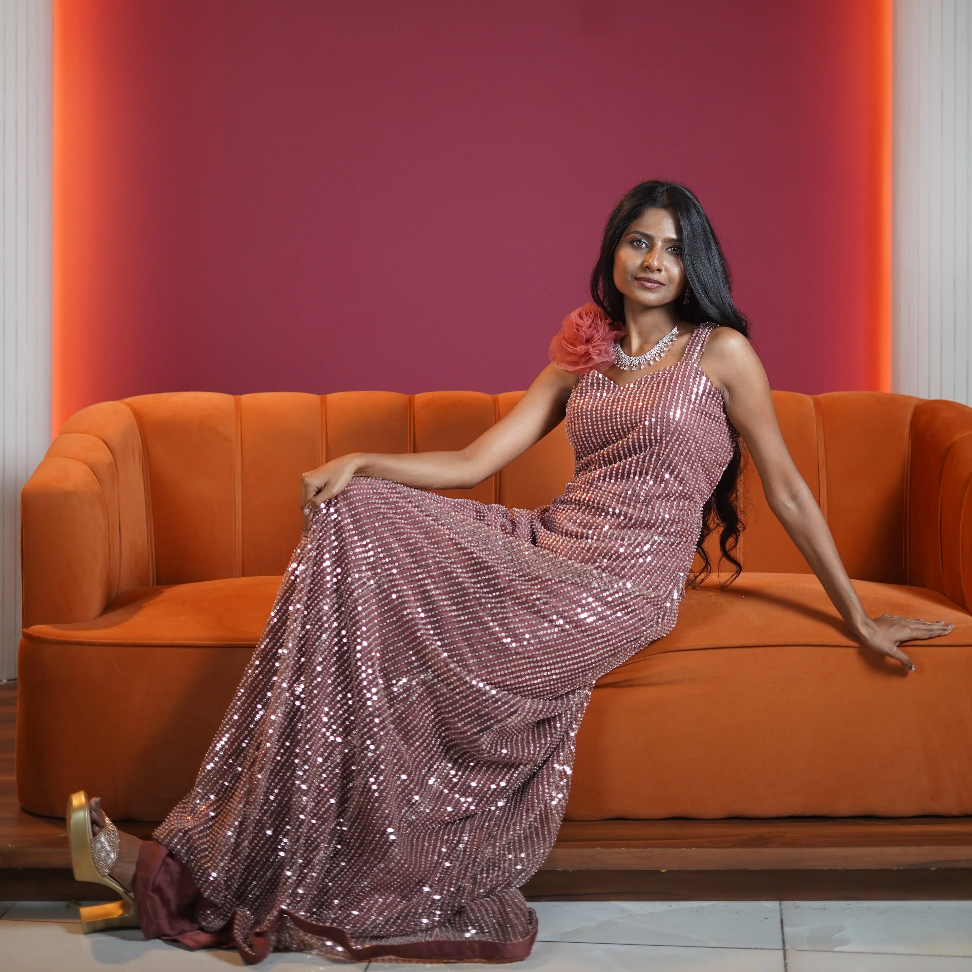 rose gold sequin evening gown with floral shoulder detail available at Posh Wedding Rental Kerala gown rental