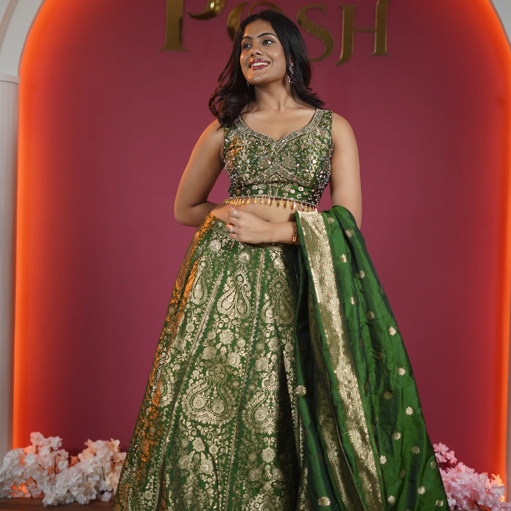 emerald green bridal lehenga with gold embroidery and dupatta available at Posh Wedding Rental Kerala lehenga rental