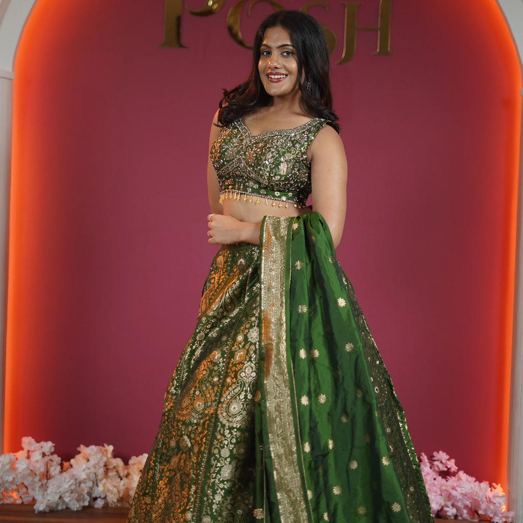 emerald green bridal lehenga with gold embroidery and dupatta available at Posh Wedding Rental Kerala lehenga rental