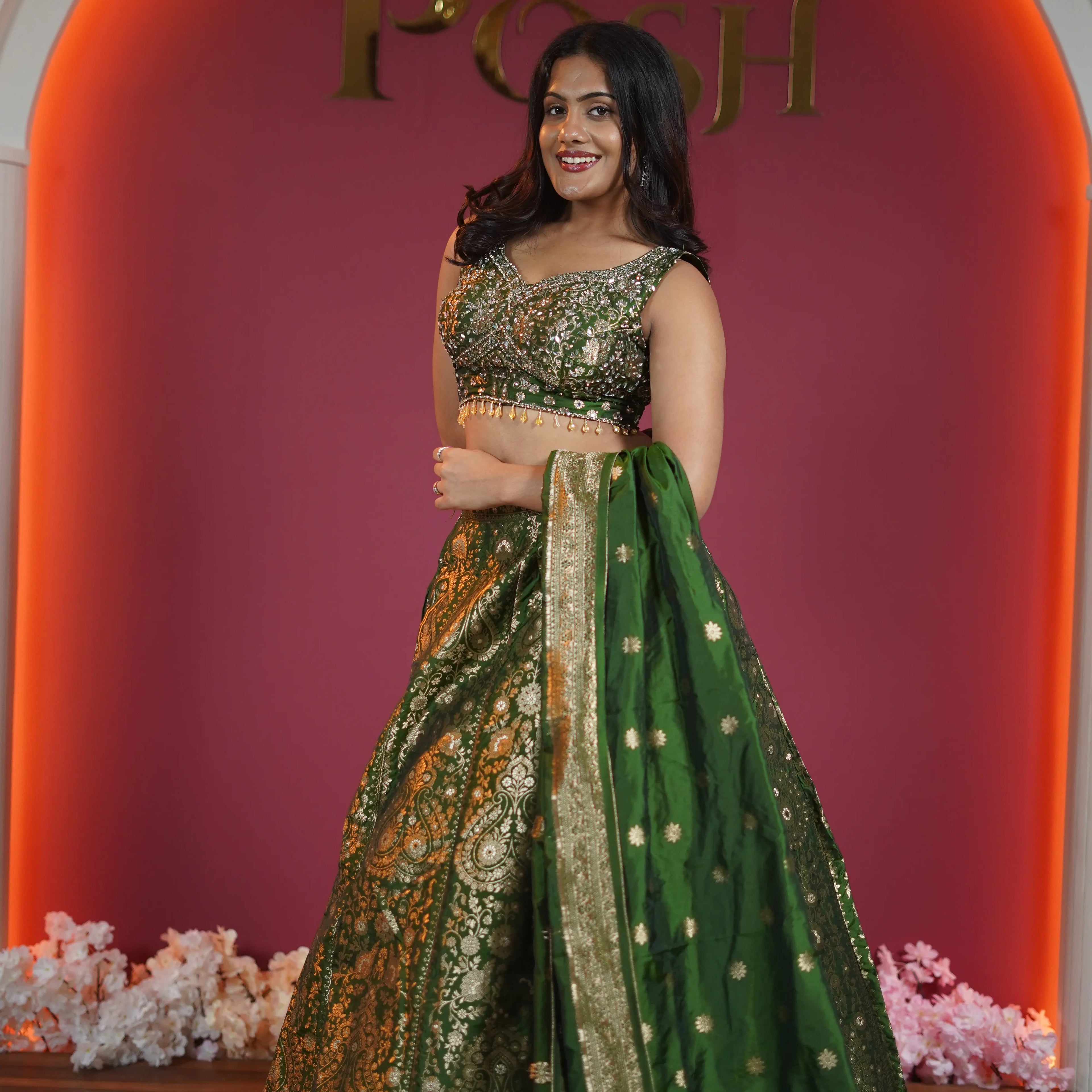 emerald green bridal lehenga with gold embroidery and dupatta available at Posh Wedding Rental Kerala lehenga rental