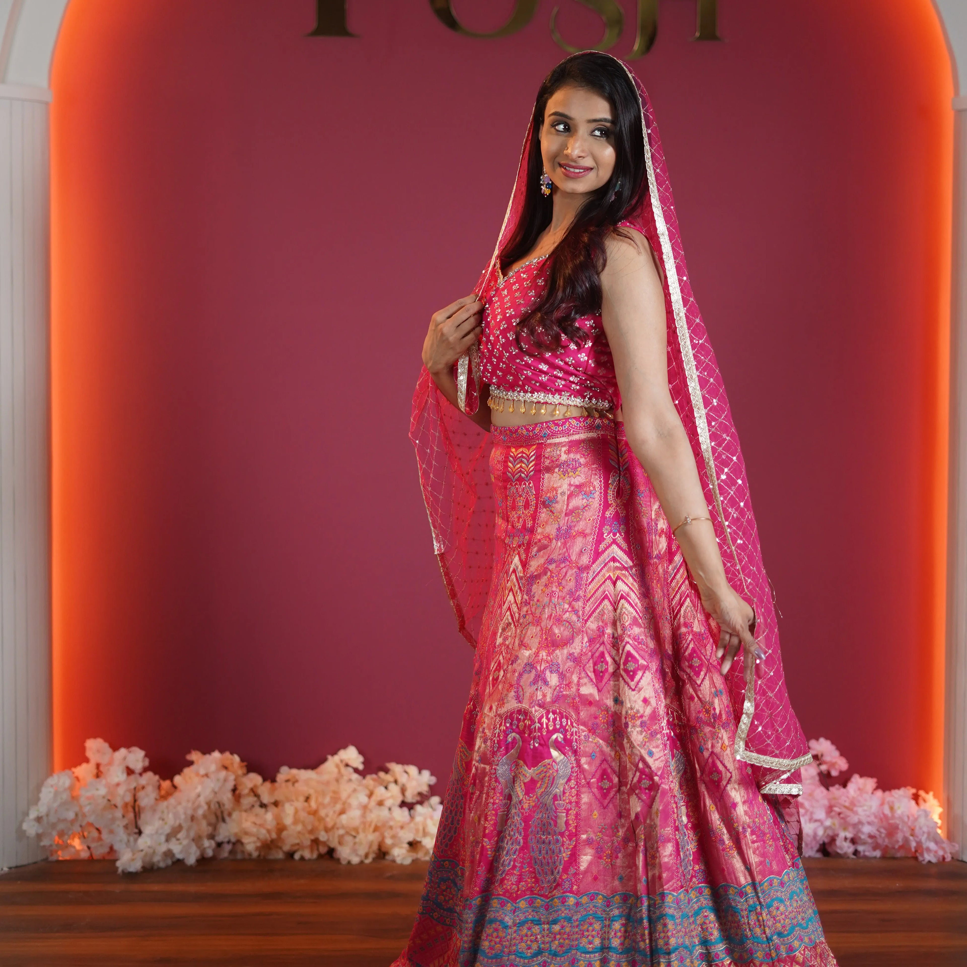 pink designer crop top lehenga with peacock motif available at Posh Wedding Rental Kerala
