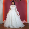white high neck bridal ball gown with sheer sleeves available at Posh Wedding Rental Kerala bridal gown rental