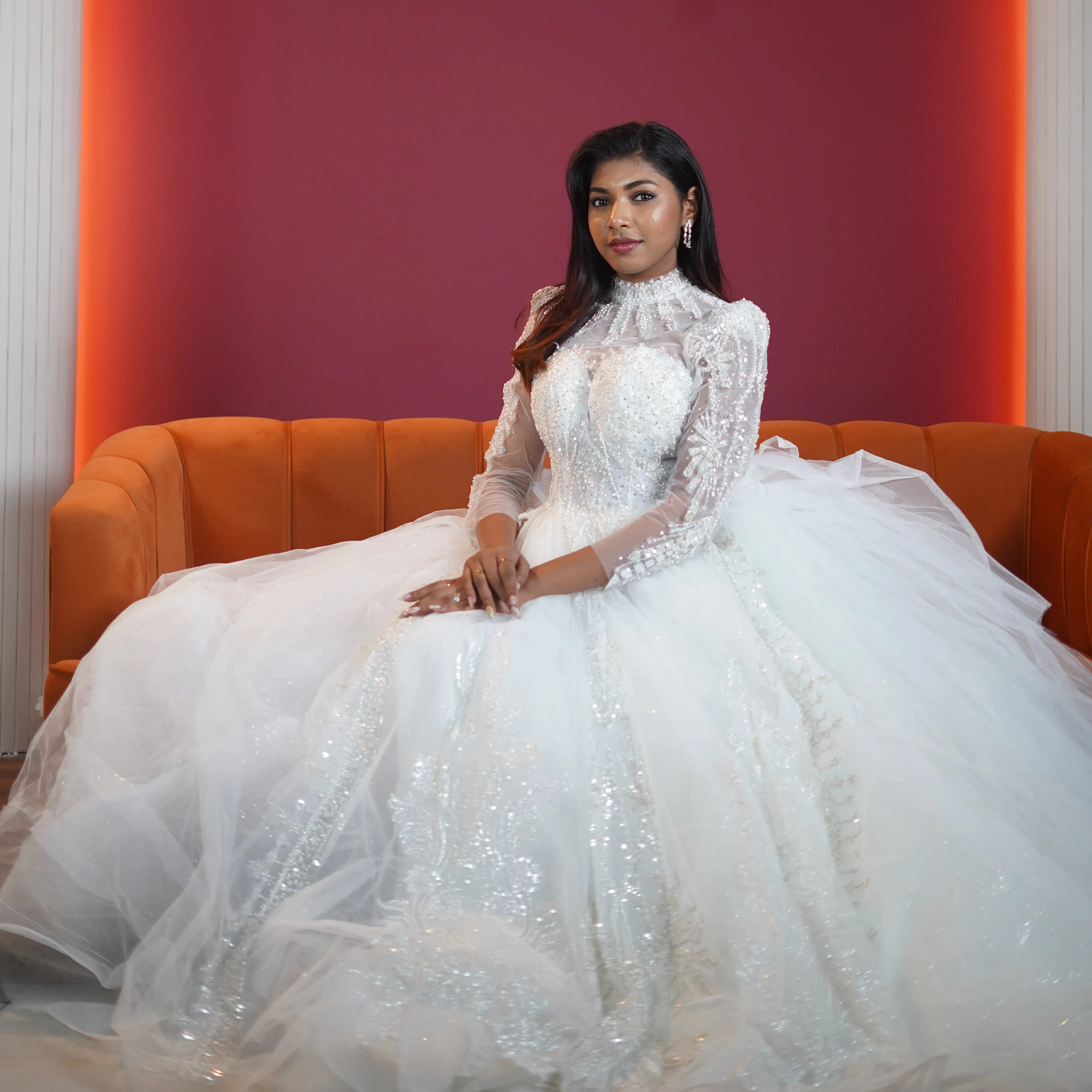 white high neck bridal ball gown with sheer sleeves available at Posh Wedding Rental Kerala bridal gown rental