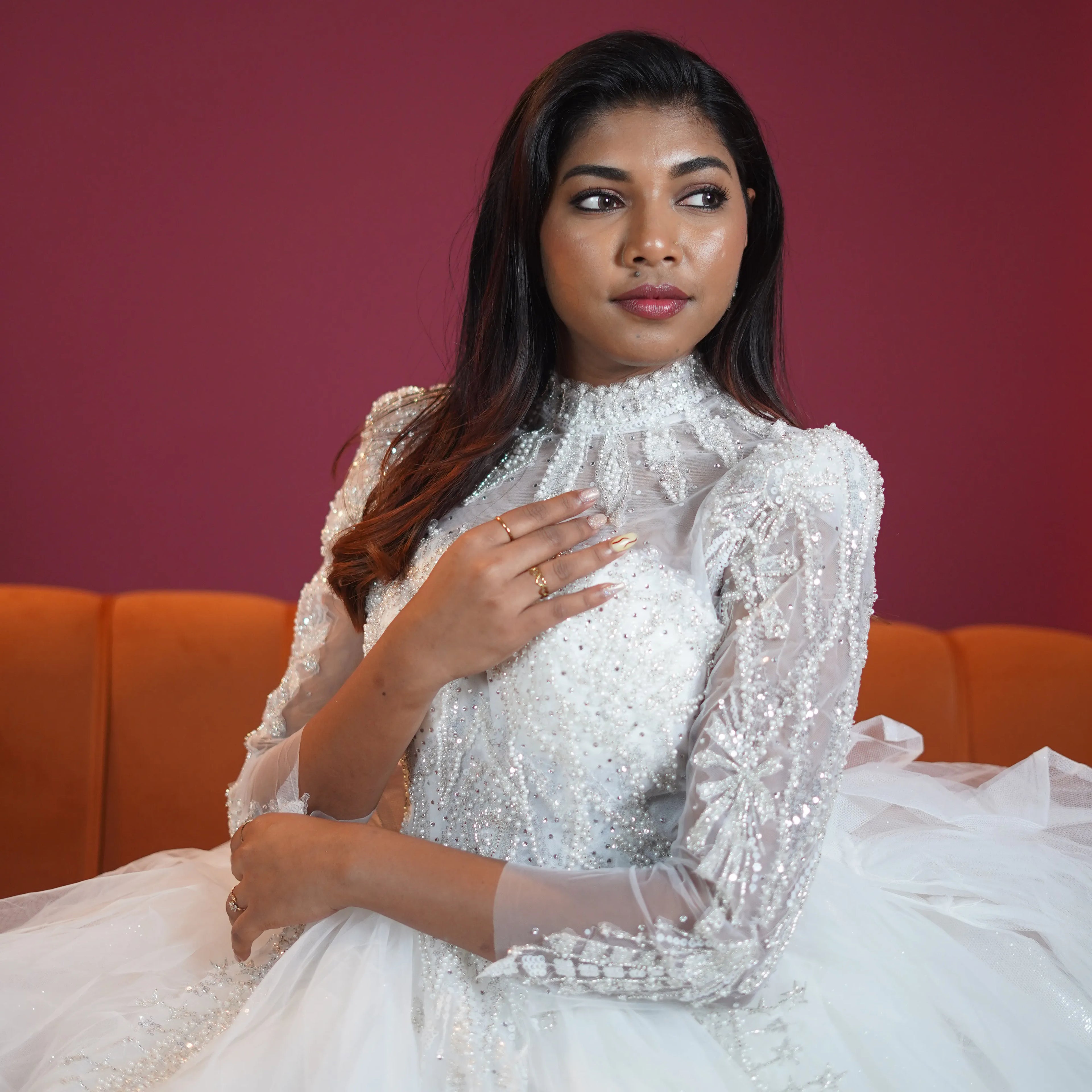 white high neck bridal ball gown with sheer sleeves available at Posh Wedding Rental Kerala bridal gown rental