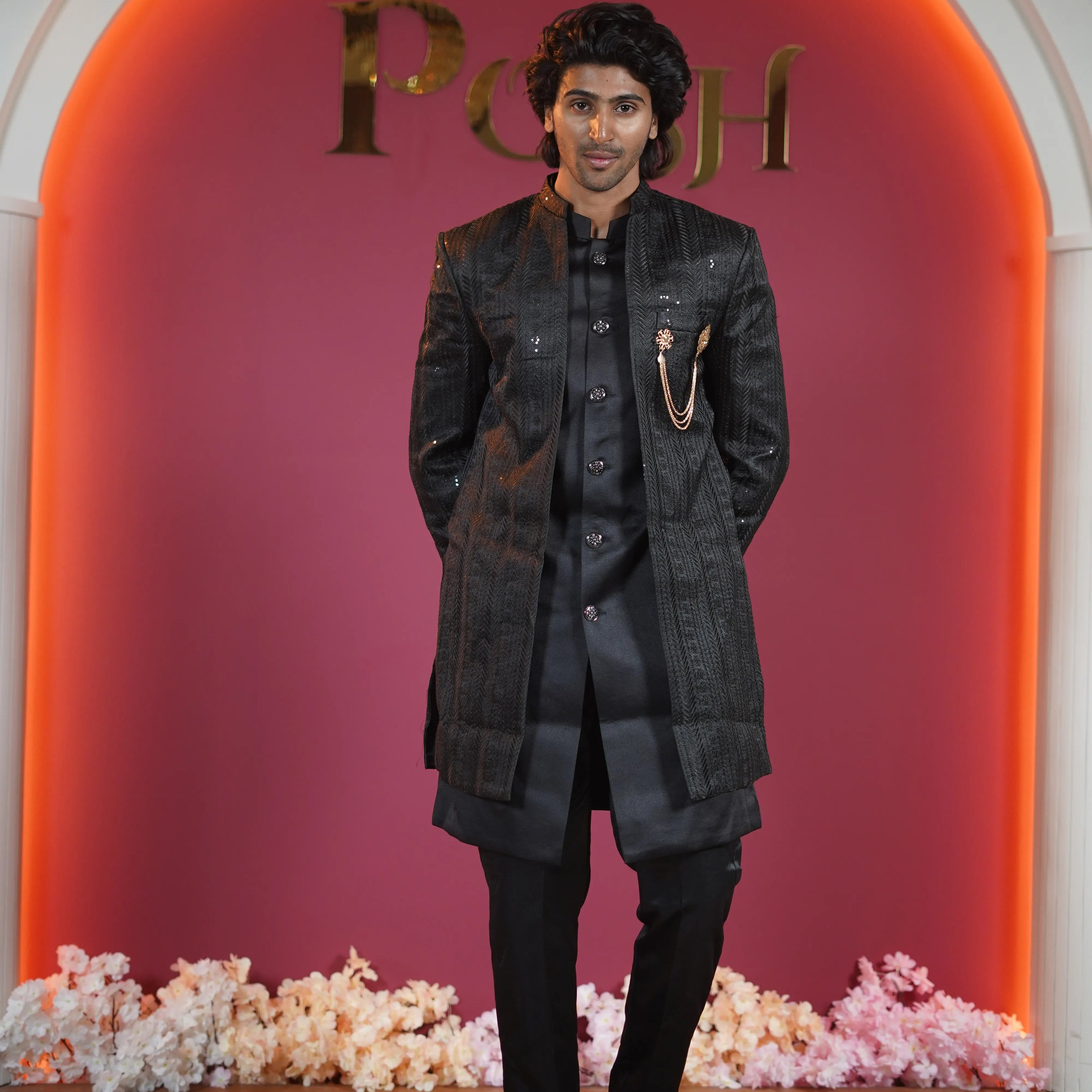 Black designer groom Indo-Western available on rent at Posh Wedding Rentals Kerala.
