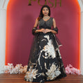 Luxury black bridal lehenga for rent in Kerala featuring gold embroidery by Posh Wedding Rentals.