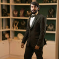 man wearing black designer tuxedo suit with embroidered shoulder detail