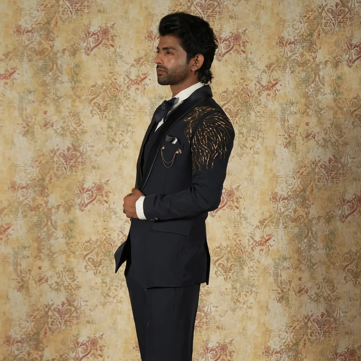 Dark blue designer tuxedo suit with gold shoulder embroidery