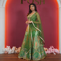 Green embroidered bridal lehenga with dupatta available on rent at Posh Wedding Rentals Kerala.