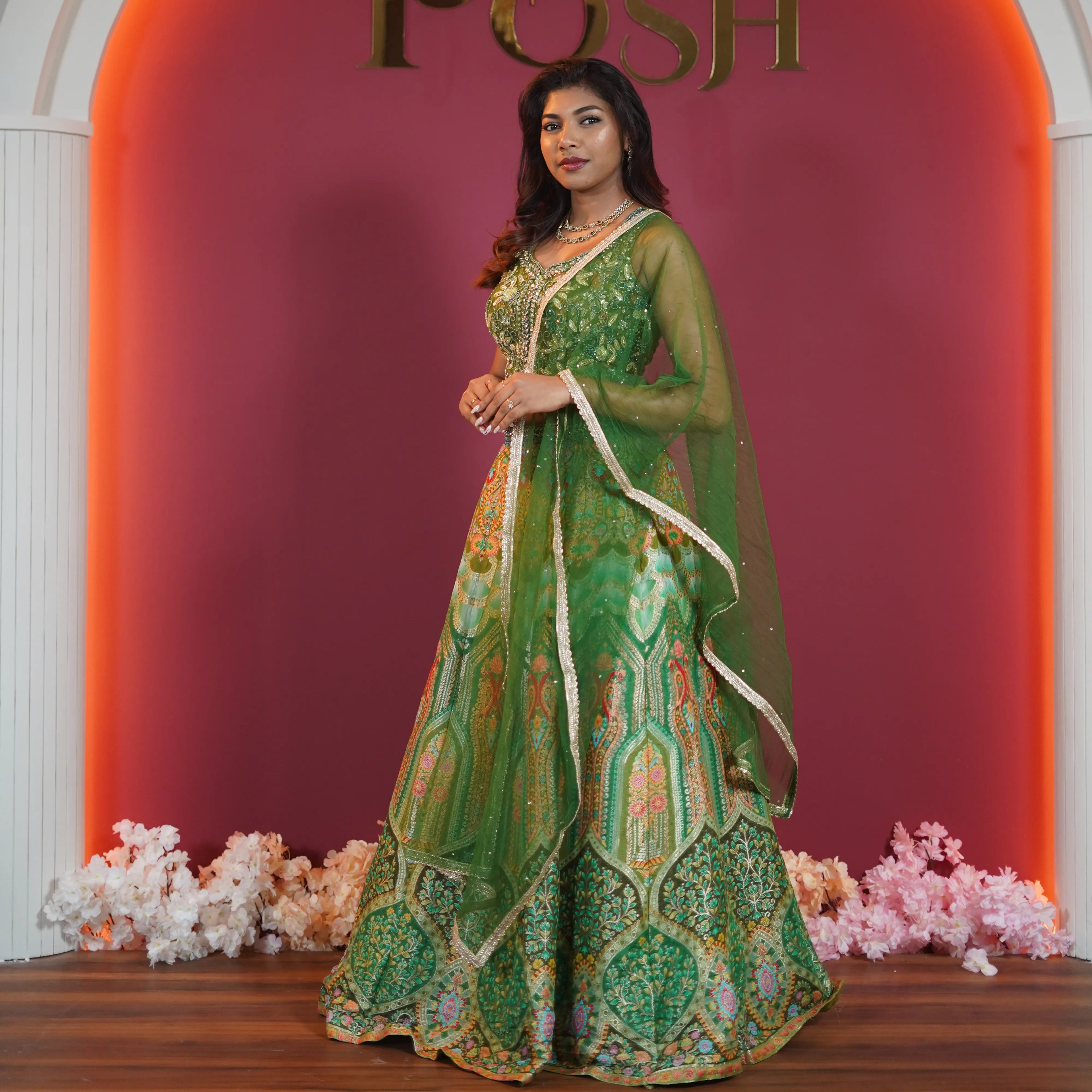 Green embroidered bridal lehenga with dupatta available on rent at Posh Wedding Rentals Kerala.