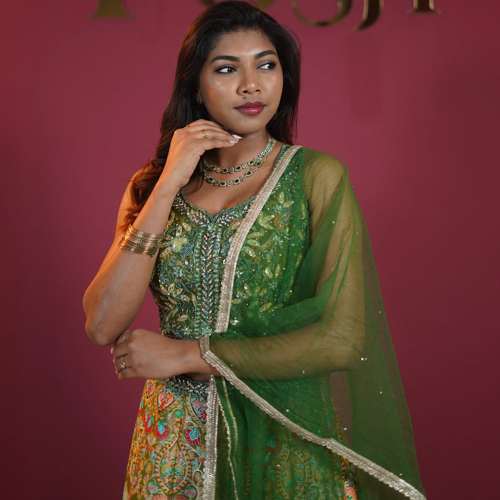 Green embroidered bridal lehenga with dupatta available on rent at Posh Wedding Rentals Kerala.