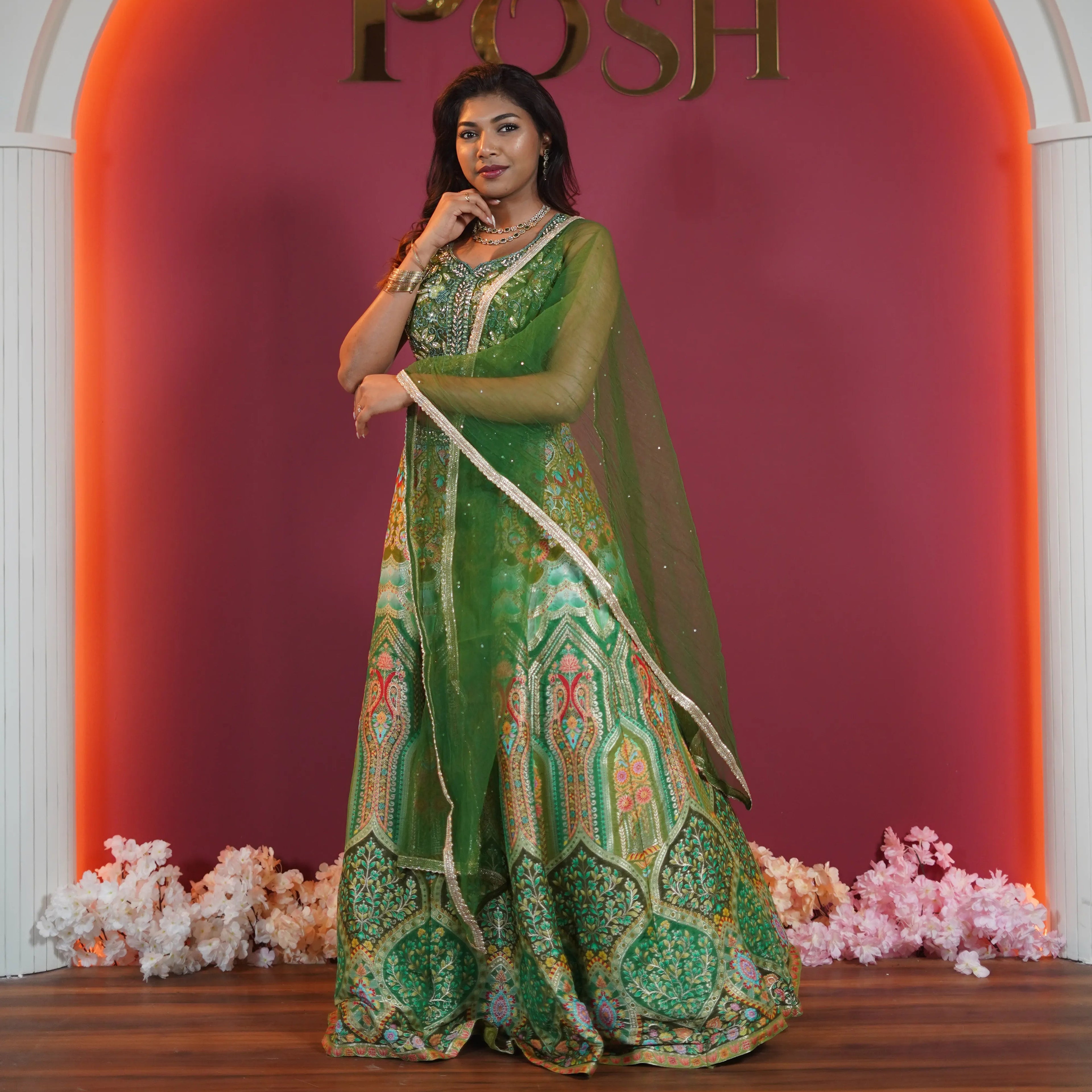 Green embroidered bridal lehenga with dupatta available on rent at Posh Wedding Rentals Kerala.