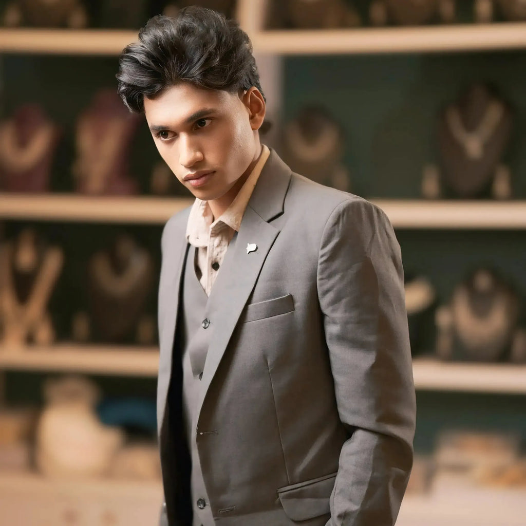 Grey three-piece groom suit for reception