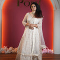 ivory embroidered bridal lehenga with net dupatta available at Posh Wedding Rental Kerala