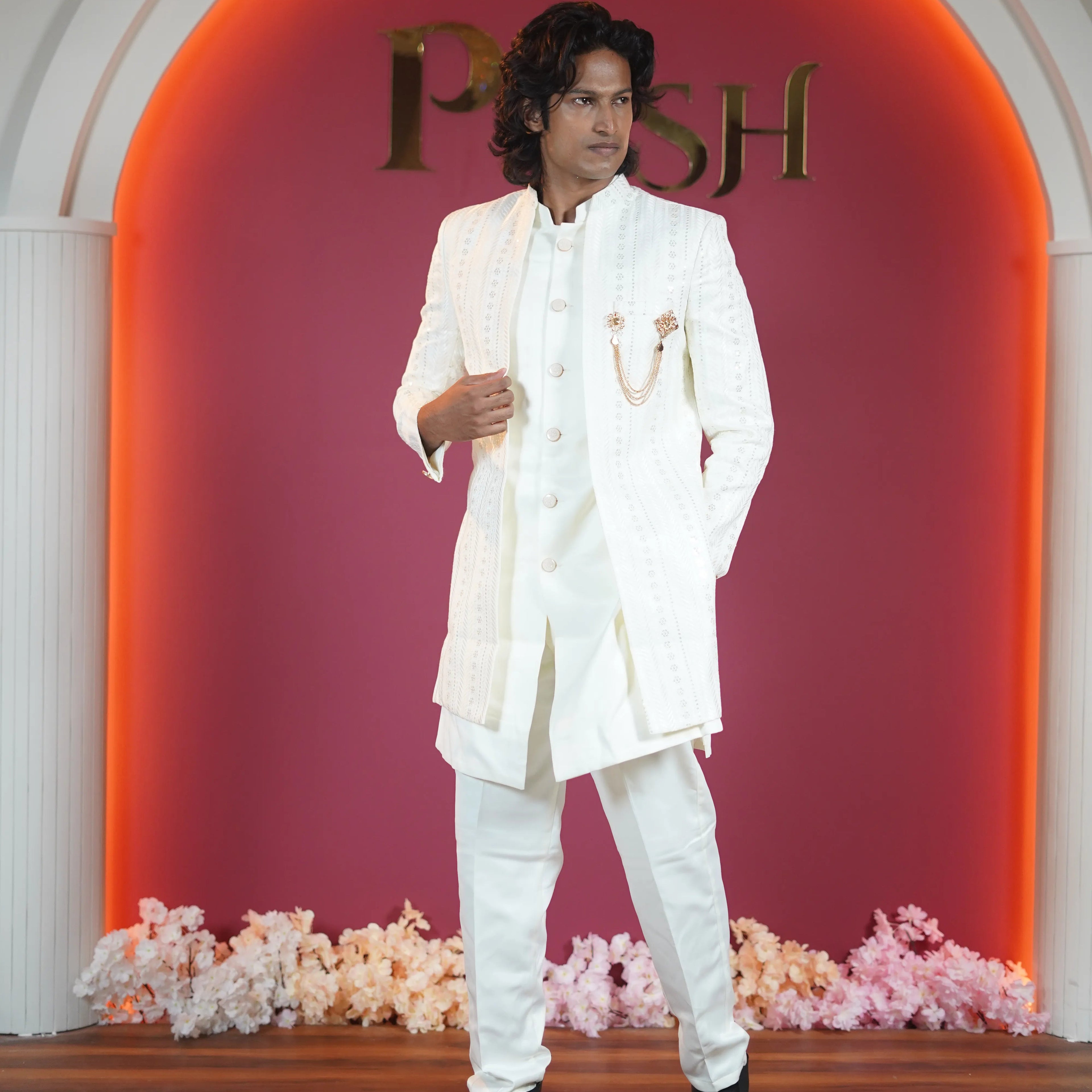 White embroidered groom Indo-Western available on rent at Posh Wedding Rentals Kerala.
