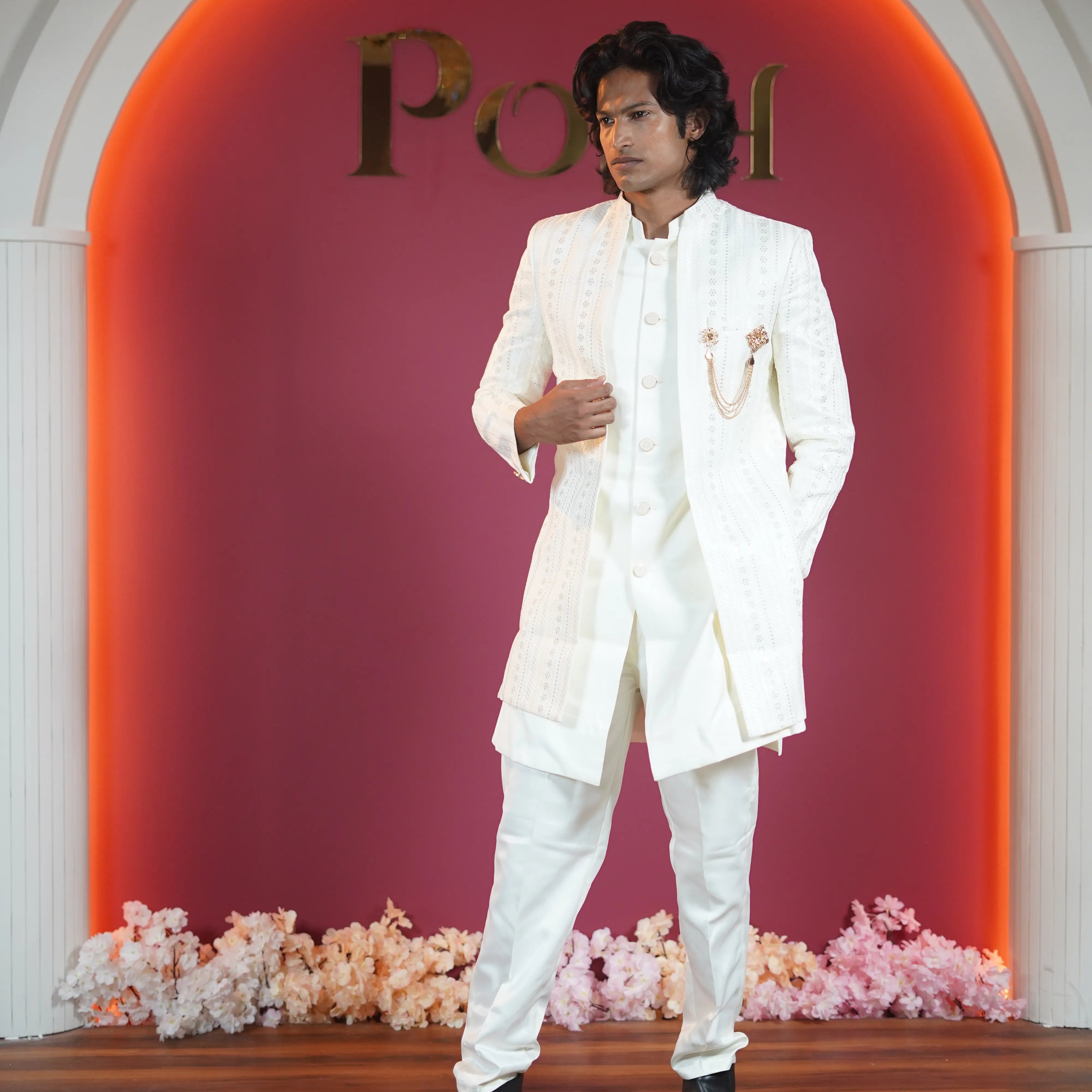 White embroidered groom Indo-Western available on rent at Posh Wedding Rentals Kerala.
