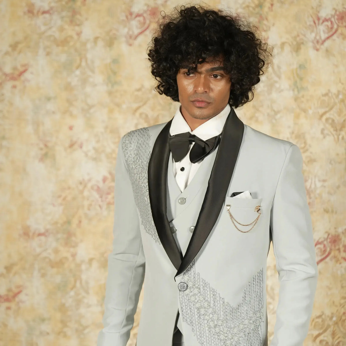 Light grey wedding suit rental with waistcoat and bow tie