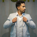 Light grey three-piece groom suit with matching waistcoat