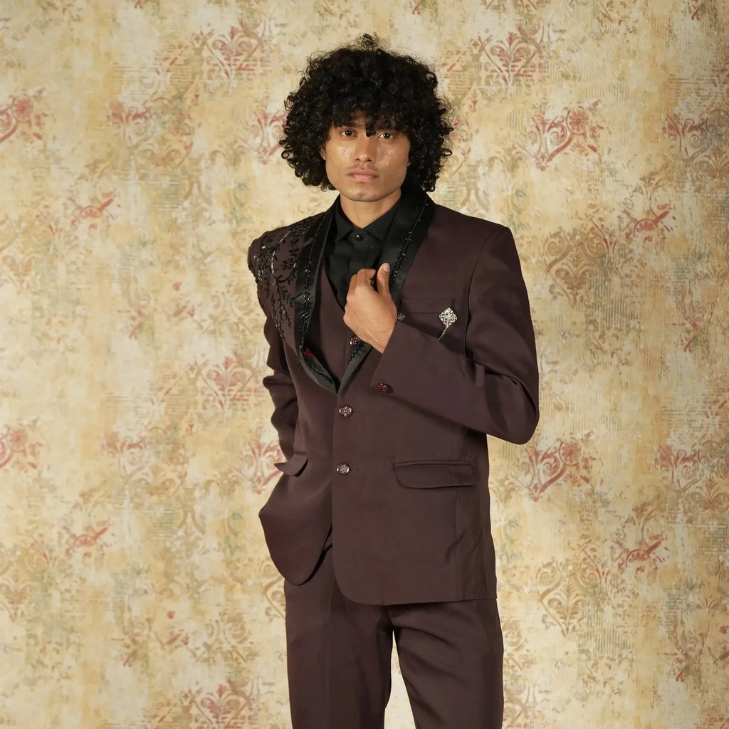 Maroon designer groom suit with black lapel and shoulder embroidery