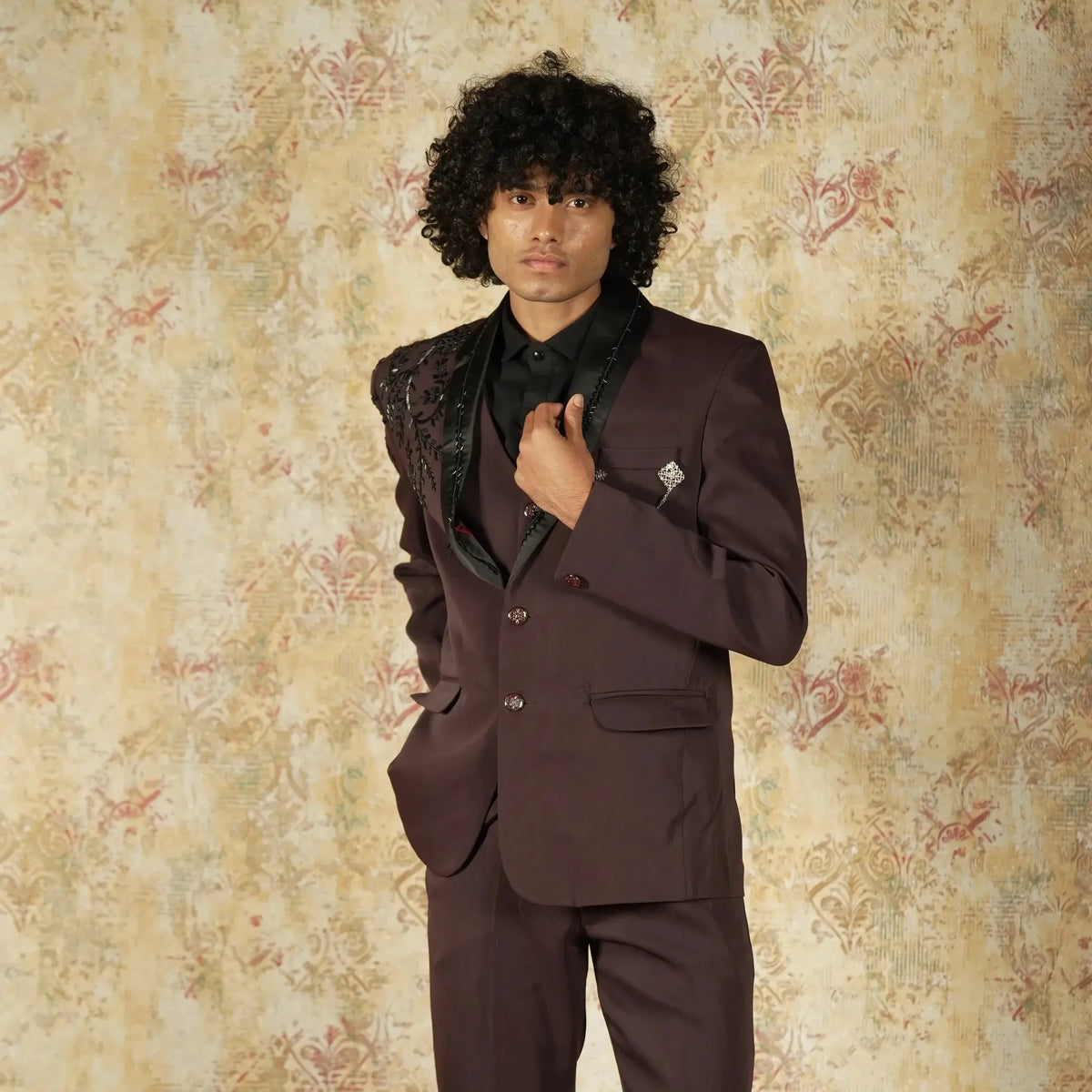 Maroon designer groom suit with black lapel and shoulder embroidery