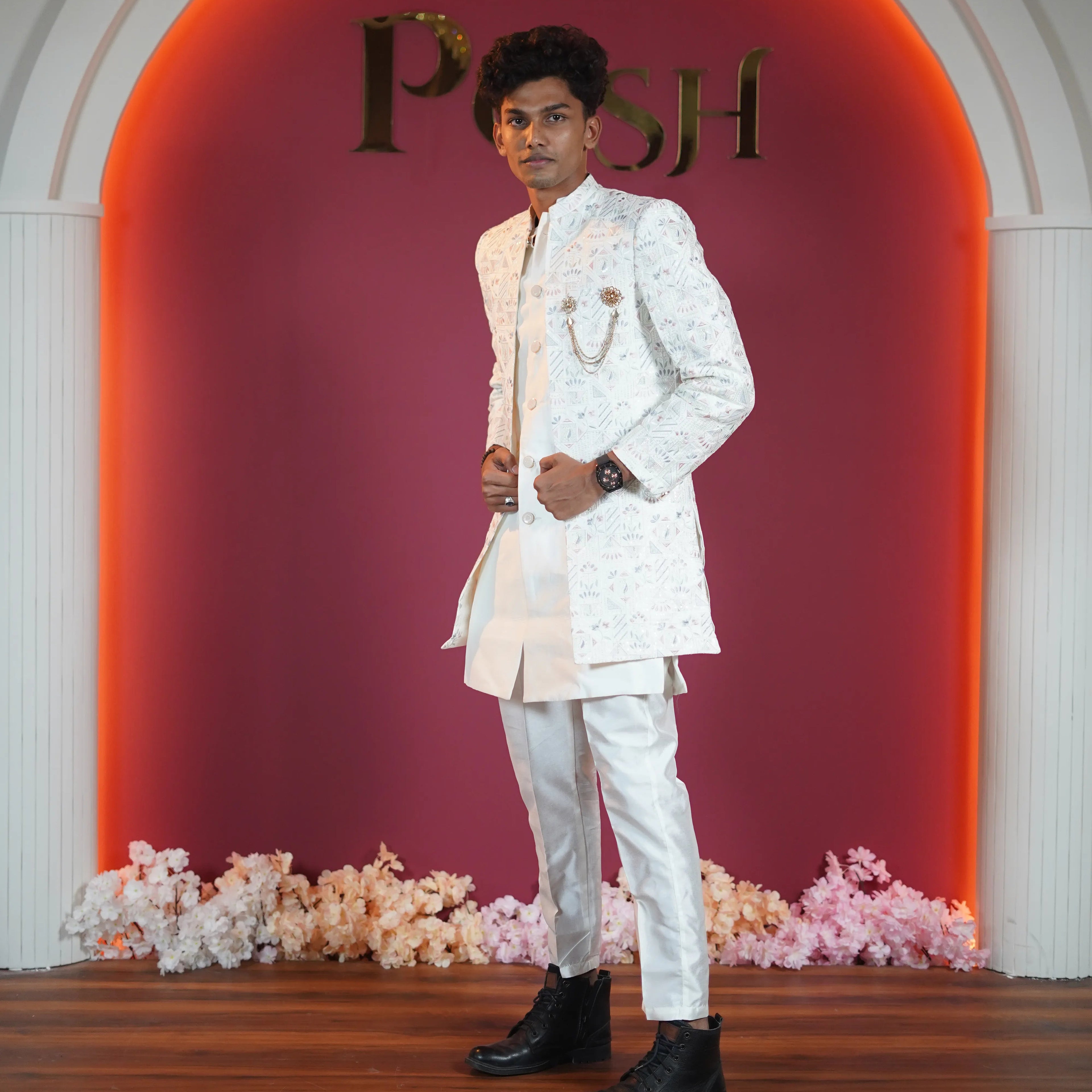 Ivory floral designer sherwani for groom available for rent at Posh Wedding Rental Kerala wedding dress rental